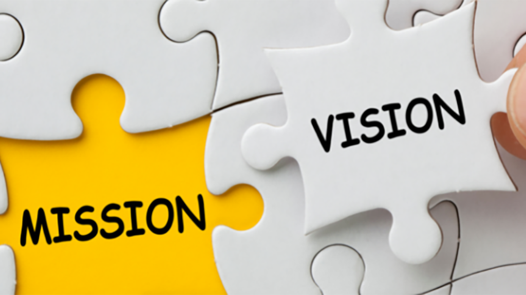 Puzzle pieces reading "Mission" and "Vision"